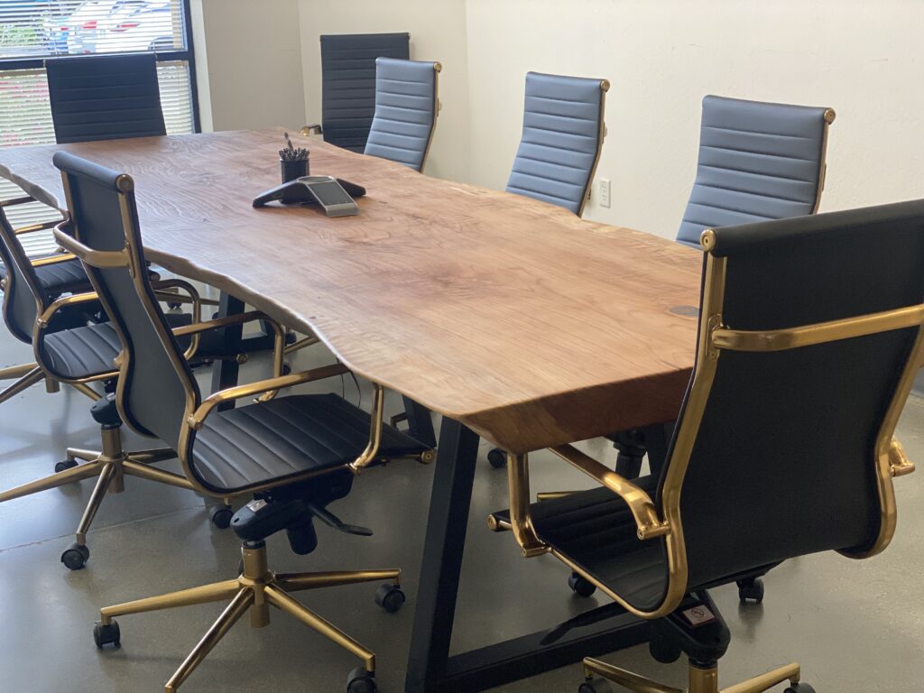 Live edge conference table in Ottawa office with modern executive chairs.