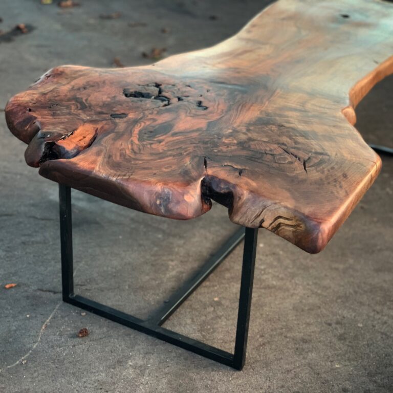 Handcrafted live edge table in Ottawa with rich natural wood grain and modern metal legs.